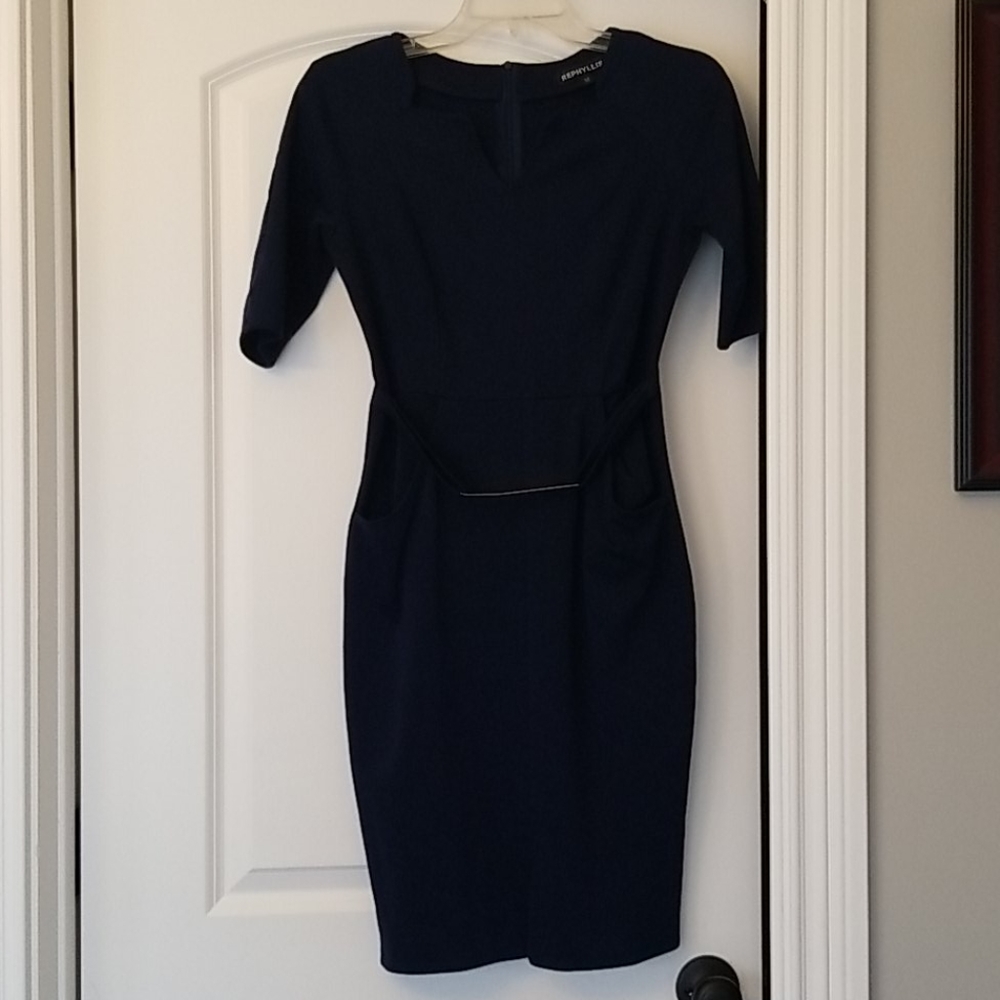 Navy dress with sleeves, pockets, and gold belt